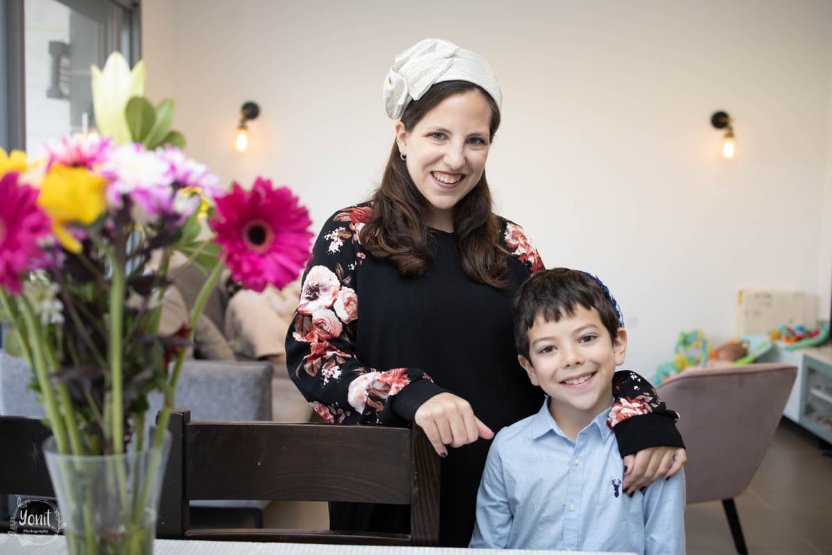 Family smiling together during an outdoor portrait session